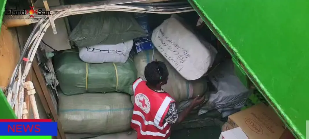 Volunteers unloading relief supplies for Cyclone Maila victims